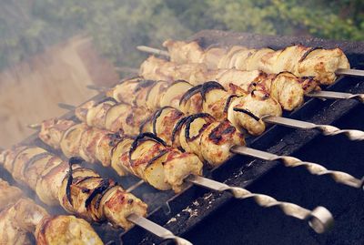 High angle view of meat on barbecue grill