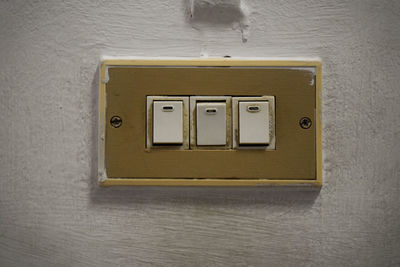 Close-up of telephone booth on wall