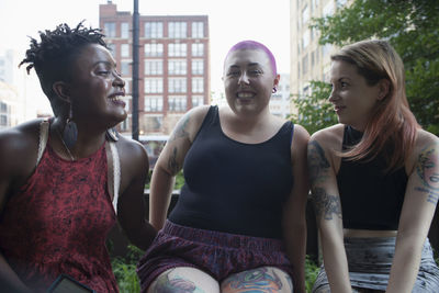 Three young women sitting down