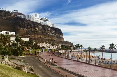 View of swimming pool by sea against sky