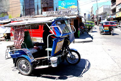 Jinrikishas on city street