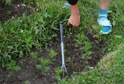 Low section of man standing on ground