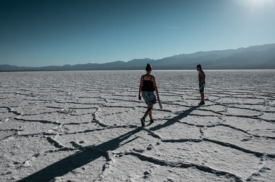 People standing on salt flat