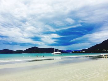 Scenic view of sea against cloudy sky