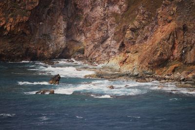 Scenic view of rocks in sea