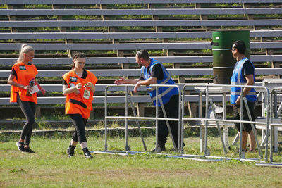 People playing soccer on field