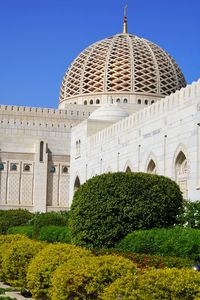 View on sultan qaboos grand mosque by clear blue sky