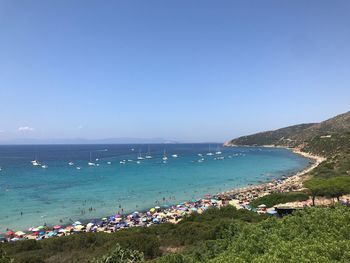 Scenic view of sea against clear blue sky