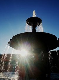 Traditional windmill against sky at night