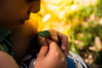 Close-up of boy holding hands