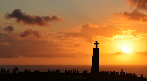 Silhouette of people on beach during sunset