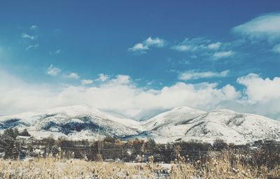 Scenic view of snowcapped mountains against sky