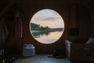 Scenic view of lake seen through boat during sunset