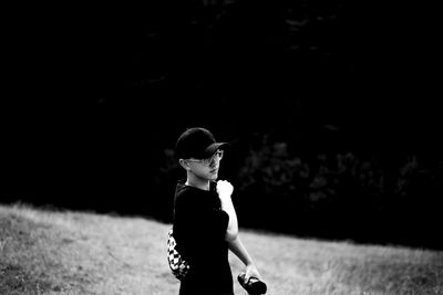 Full length of boy standing on field