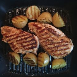 Close-up of meat on barbecue grill