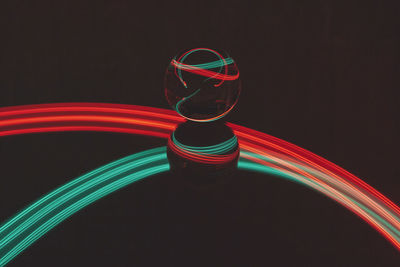 Multi colored light painting against black background