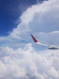 Low angle view of airplane flying in sky