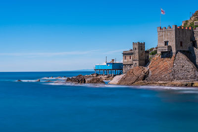 Scenic view of sea against blue sky