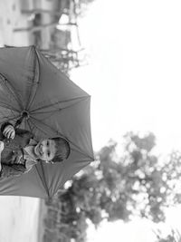 Portrait of girl against tree