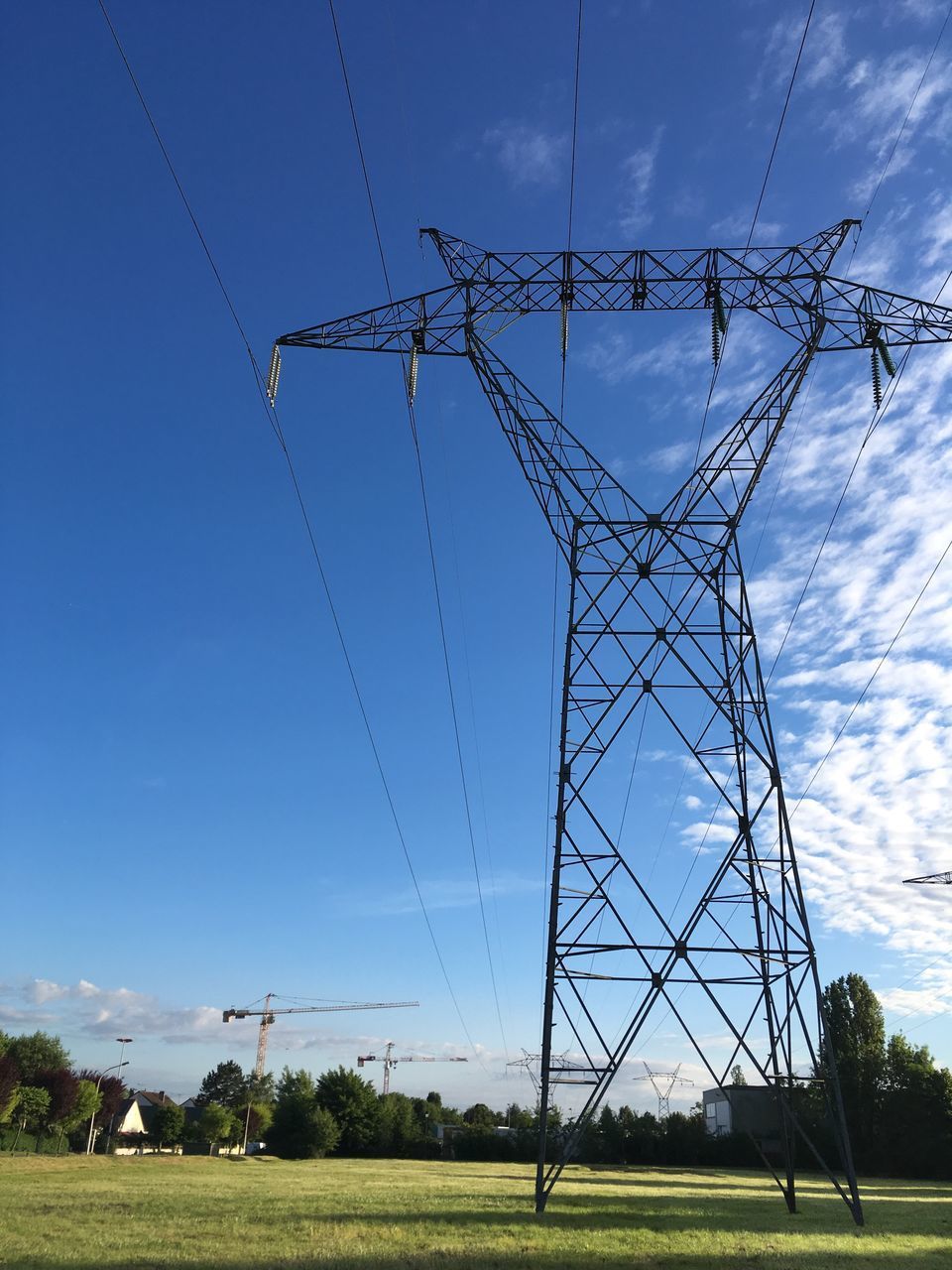 LOW ANGLE VIEW OF ELECTRICITY PYLONS AGAINST SKY