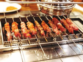 High angle view of meat on barbecue grill