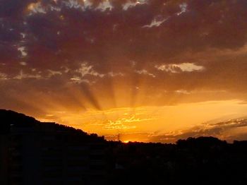 Scenic view of dramatic sky during sunset