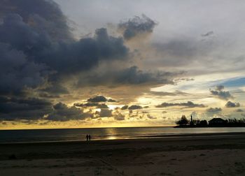 Scenic view of sea against cloudy sky