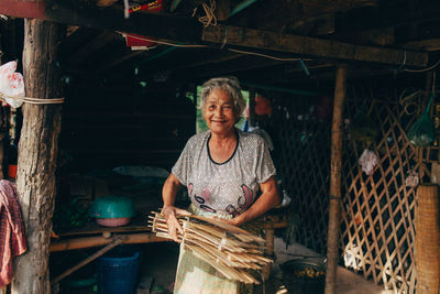 Portrait of woman in wooden door