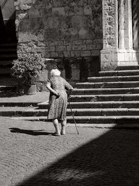 Shadow of woman walking on steps