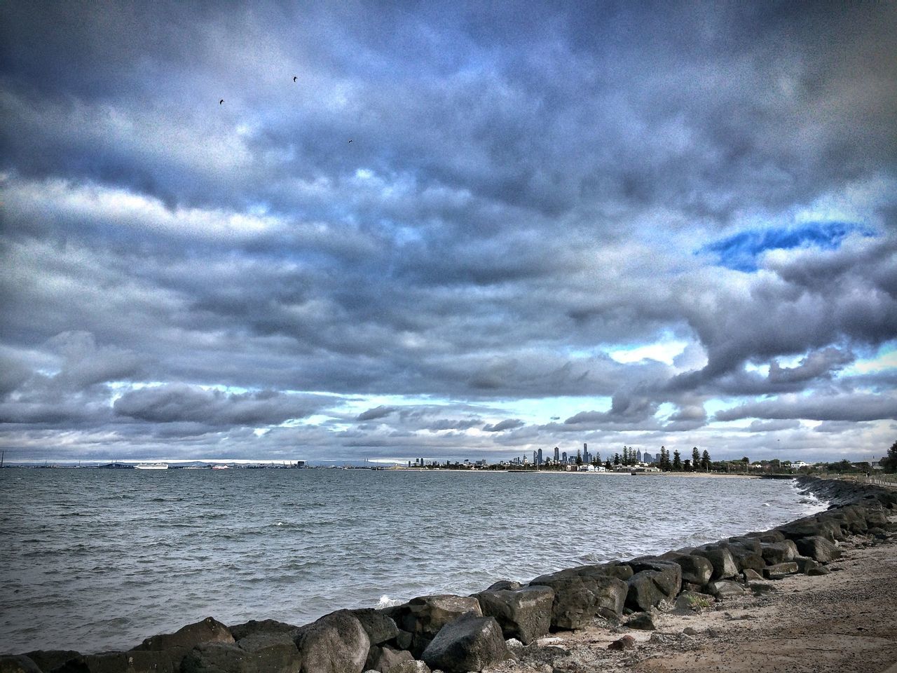 sky, water, sea, cloud - sky, cloudy, horizon over water, scenics, tranquility, tranquil scene, beach, beauty in nature, overcast, weather, nature, cloud, shore, storm cloud, bird, idyllic, dusk