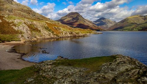 Scenic view of lake and mountains against sky