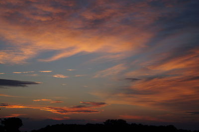 Low angle view of dramatic sky during sunset