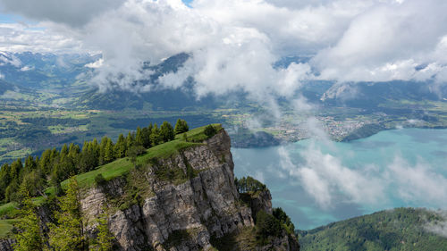 Panoramic view of land and mountains against sky