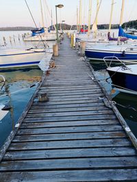 Boats moored at harbor