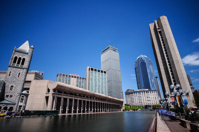 Low angle view of buildings against blue sky