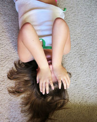 High angle view of woman sitting at home