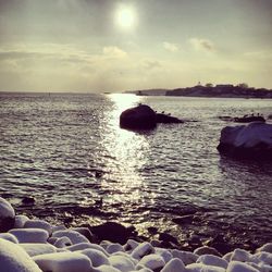 Scenic view of sea against cloudy sky