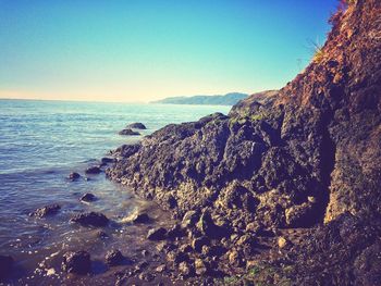 Scenic view of sea against clear blue sky