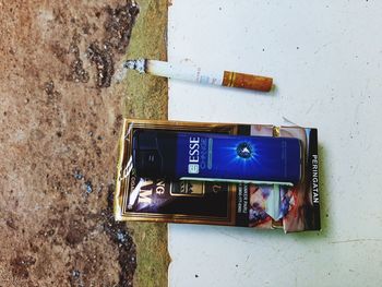 Low angle view of telephone booth on wall