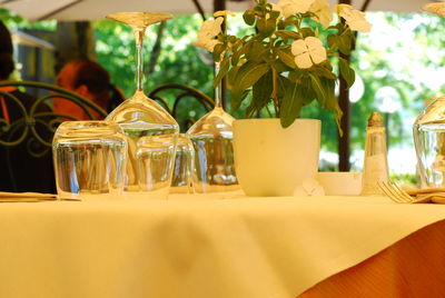 Close-up of glasses on table in restaurant