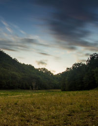 Scenic view of field against sky during sunset