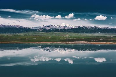 Scenic view of snowcapped mountains against sky