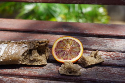 Close-up of orange on cutting board