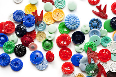 Full frame shot of colorful buttons on white background