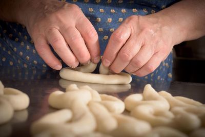 Close-up of person preparing food on table