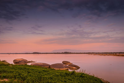 Scenic view of lake against sky during sunset