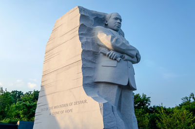 Low angle view of statue against sky