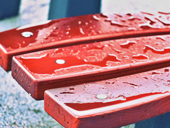 Water drop on wooden bench closeup. oiled wooden planks surface resistent to water drops