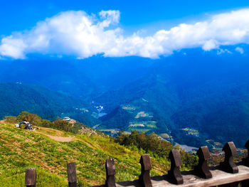 Scenic view of mountains against cloudy sky