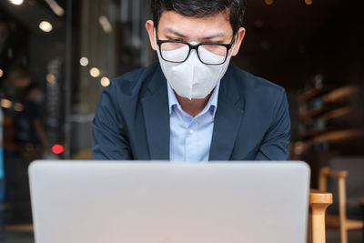 Man using laptop on table